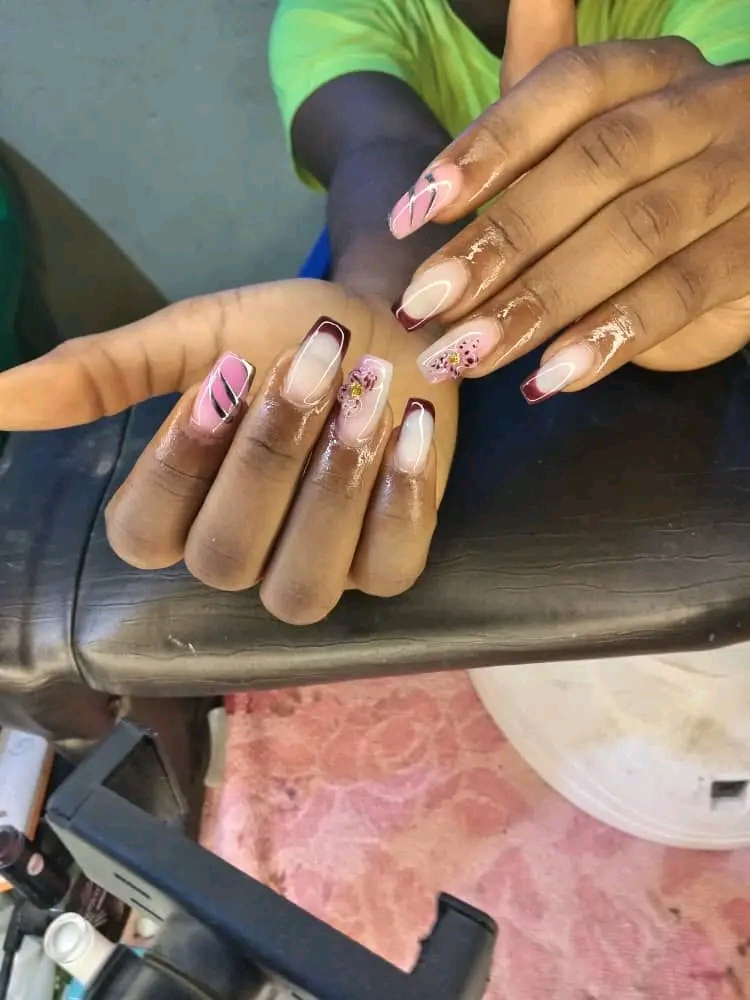 Mbewe's nails