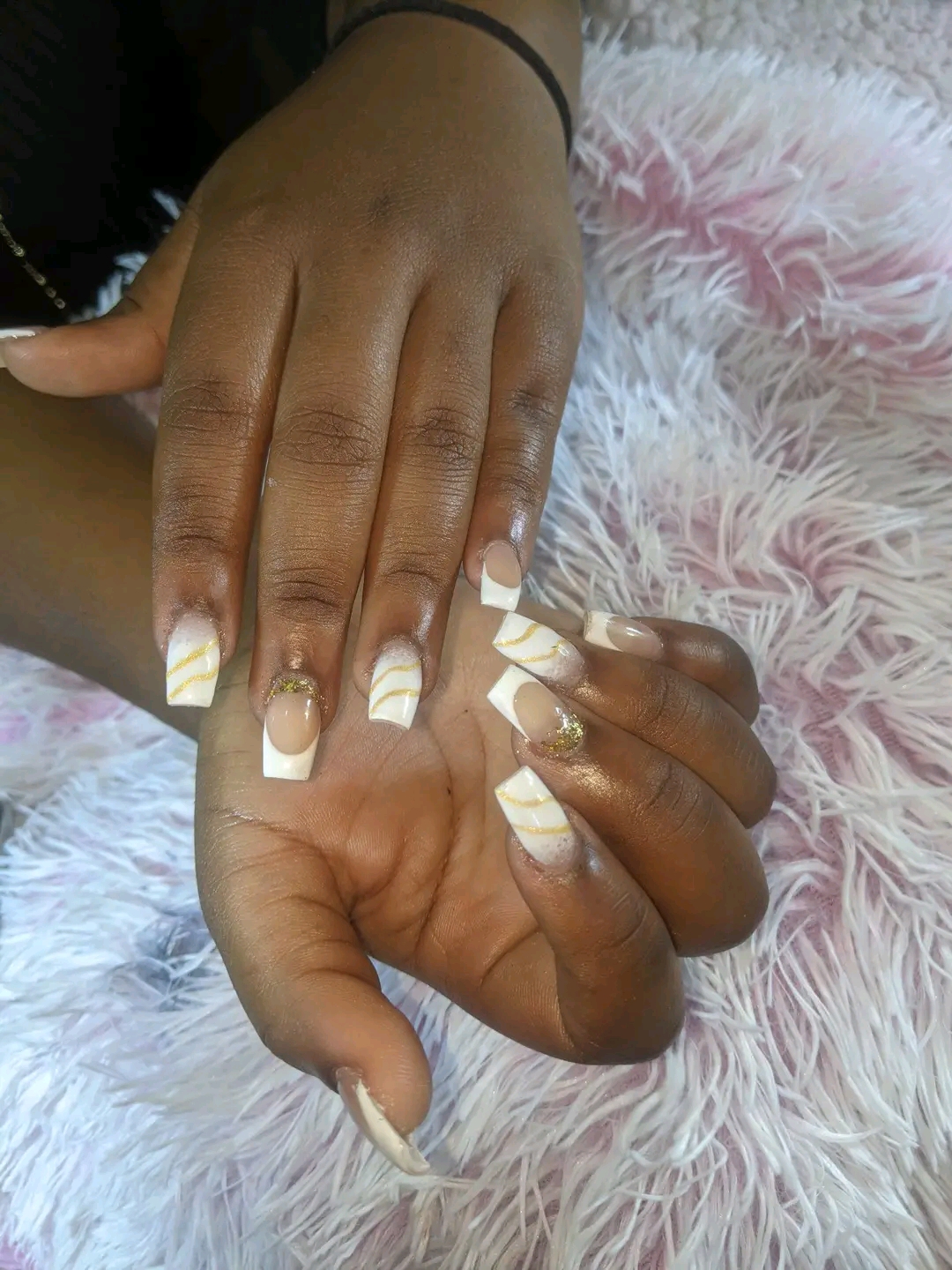 Mbewe's nails